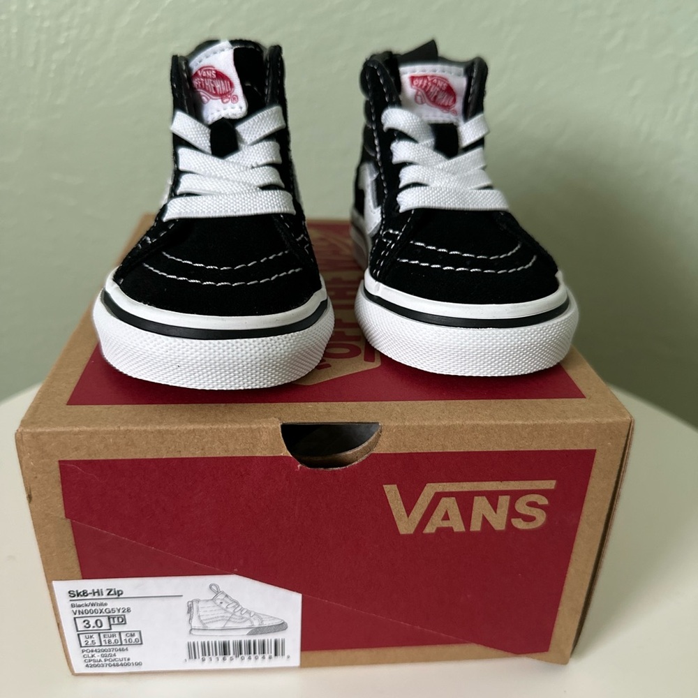 Vans Black and White High-Top Sneakers